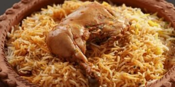 chicken in a plate and also rice in the plate