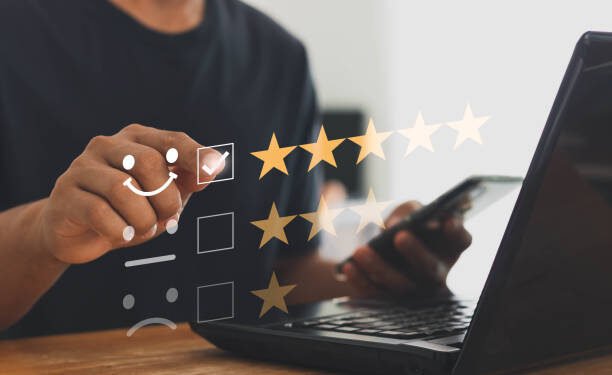 Online customer service and satisfaction survey concept with internet technology. Finger of businessman touching and check mark icon face emoticon smile, service mind, service rating. Work from home.